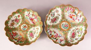 TWO 19TH CENTURY CHINESE CANTON FAMILLE ROSE PLATES - each decorated with panels of figures with