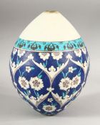 A TURKISH OTTOMAN KATAHYA POTTERY HANGING BALL - decorated with floral motif decoration - 21cm