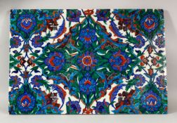 A LARGE POSS 19TH CENTURY IZNIK POTTERY TILE - decorated with a blue ground with floral motif