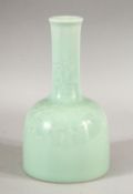 A CHINESE CELADON GLAZED PORCELAIN BOTTLE VASE, the base with six character mark, 19cm high.