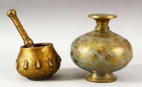 A 17TH/18TH CENTURY MUGHAL BRASS PESTLE AND MORTAR, together with an engraved and chased brass