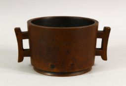 A GOOD CHINESE BRONZE TWO HANDLED CENSER, impressed mark to base, 11cm diameter.