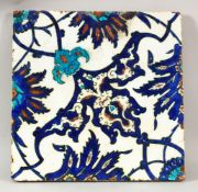 A 17TH CENTURY TURKISH OTTOMAN PORCELAIN TILE - decorated with a blue & white ground with floral