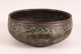A 16TH CENTURY PERSIAN EARLY SAFAVID ENGRAVED BRONZE BOWL, 23cm diameter.
