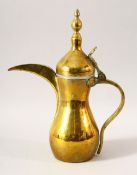 A TURKISH BRASS COFFEE POT - the side with an impressed mark, 32cm