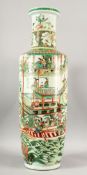A VERY GOOD LARGE CHINESE FAMILLE VERTE TALL SLENDER VASE, with a continuous scene of dragons,