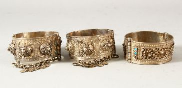 THREE 19TH CENTURY OTTOMAN BALKANS SILVER BANGLES, inset with turquoise stones, each approx. 6cm