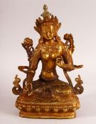 A CHINESE TIBETAN GILT BRONZE FIGURE OF A DEITY - in a seated mudra pose, the base wwith an