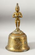 A LARGE INDIAN GILT BRONZE TEMPLE BELL, the bell with engraved and chased decoration depicting