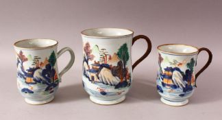 THREE 18TH CENTURY CHINESE IMARI PORCELAIN TANKARDS - each decorated in a similar style depicting