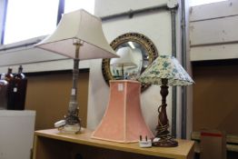 Two table lamps, a mirror and a shade.