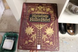 A large gilt decorated, cloth bound German Bible.