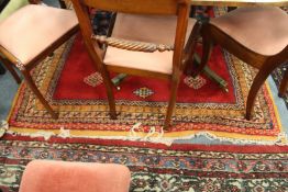 A large Afghan woollen rug.