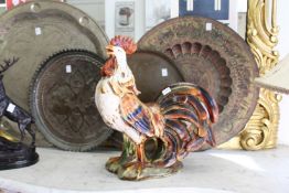 A large painted pottery model of a cockerel.