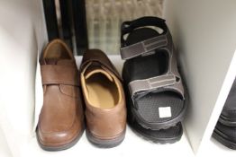 A new pair of gentlemen's size 10 Clark's shoes and a pair of sandals.