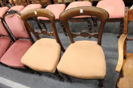 A pair of Victorian mahogany dining chairs.