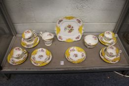 An unusual Paragon china part service, white ground with floral and exotic bird decoration and