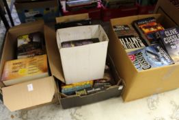 A quantity of Wilbur Smith, Clive Cussler and other books.