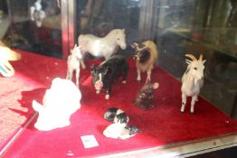 A good collection of Beswick animal figures to include a sow and piglet on its back, horses, goats