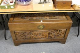 A Chinese carved camphor wood coffer.