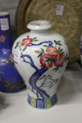 A Chinese Meiping shaped vase painted with a peach tree.