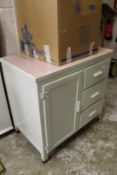 An old painted kitchen cupboard unit.