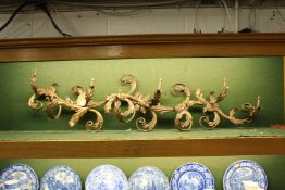 A decorative naturalistic shaped ormolu eight branch light fitting.