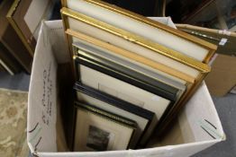 A box of various painting and prints.