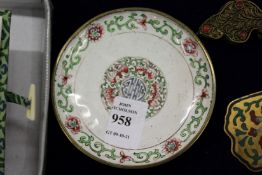 A small Chinese circular cloisonne dish.