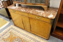 A 19th century French marble top burr wood side cabinet with a pair of frieze drawers over two doors