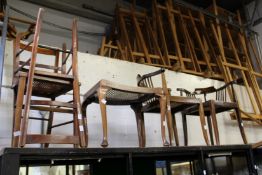 A pair of cane seated chairs, a similar stool and a pair of corner armchairs.