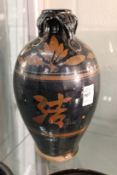 A Chinese large bottle vase decorated with calligraphy.