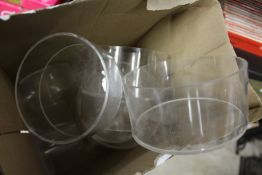 A box of perspex stands.