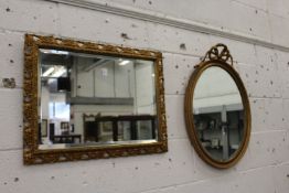 Two gilt framed mirrors.
