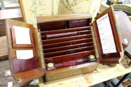An Edwardian mahogany stationery cabinet with fitted interior.