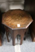 An eastern brass inlaid octagonal occasional table.