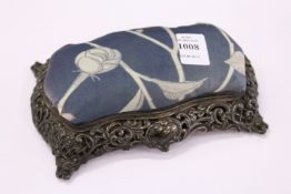A silver combination pin cushion / jewellery box.