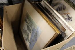 A box of assorted paintings and prints.