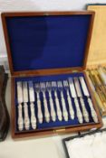 A cased set of eighteen silver handled dessert knives and forks.