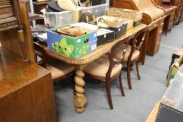 A good early 20th century Indian teak extending dining table with one leaf on barley twist legs.