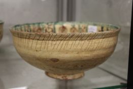 An early Islamic pottery bowl.