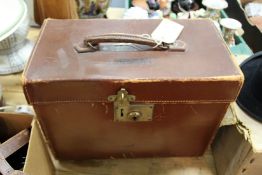 A leather cased top hat by Lincoln Bennett & Co.