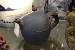 A Chinese blue ground Yixing teapot.