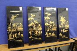 A set of four Vietnamese lacquer panels.