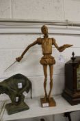 A carved wood model of Don Quixote.