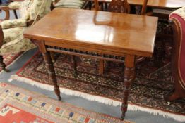 A Victorian mahogany rectangular foldover card table.
