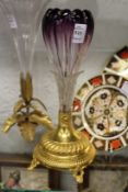 An amethyst tinted tulip shaped glass vase with ormolu base.