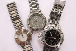 Three stainless steel designer wristwatches.