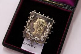 A silver brooch commemorating Queen Victoria's Golden Jubilee.