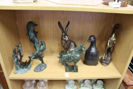 A carved hardstone Tang style horse, bronze dolphins and other ornamental items.